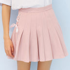 Pleated skirt with bow tie